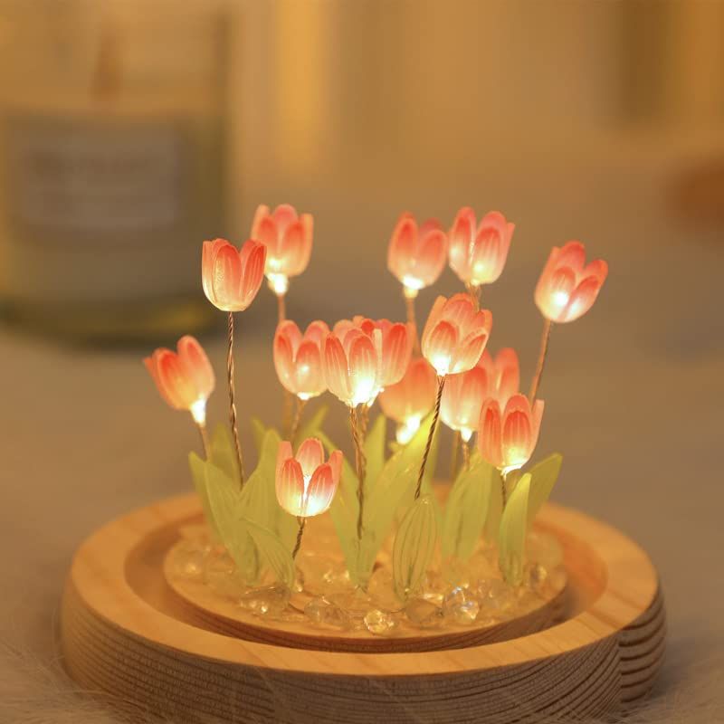 Handmade tulip night light from Everything Baby, resembles a blooming flower, used as a cozy bedroom table lamp for kids and children.