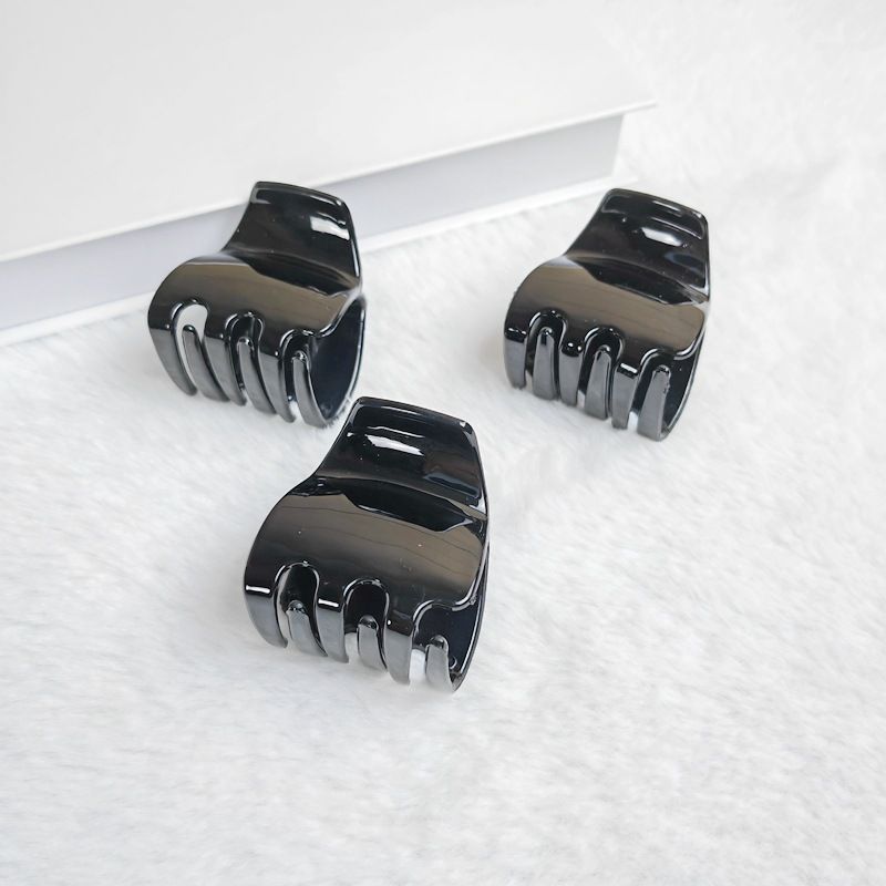 Three black jaw clips for thick hair, non-slip mini oval hair claws for women and girls, from Everything Baby.