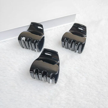 Three black jaw clips for thick hair, non-slip mini oval hair claws for women and girls, from Everything Baby.