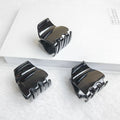 Three black jaw clips for thick hair, non-slip mini oval hair claws for women and girls, from Everything Baby grooming kit.