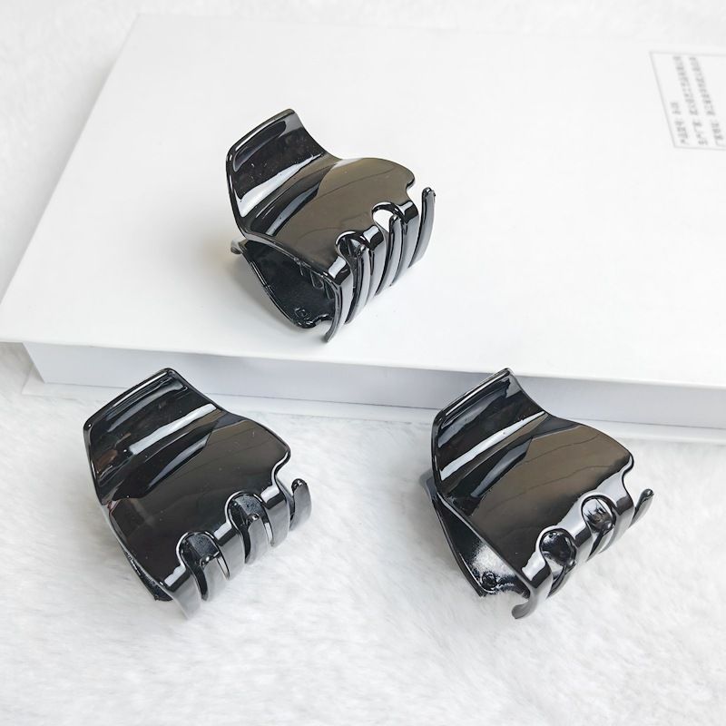 Three black jaw clips for thick hair, non-slip mini oval hair claws for women and girls, from Everything Baby grooming kit.