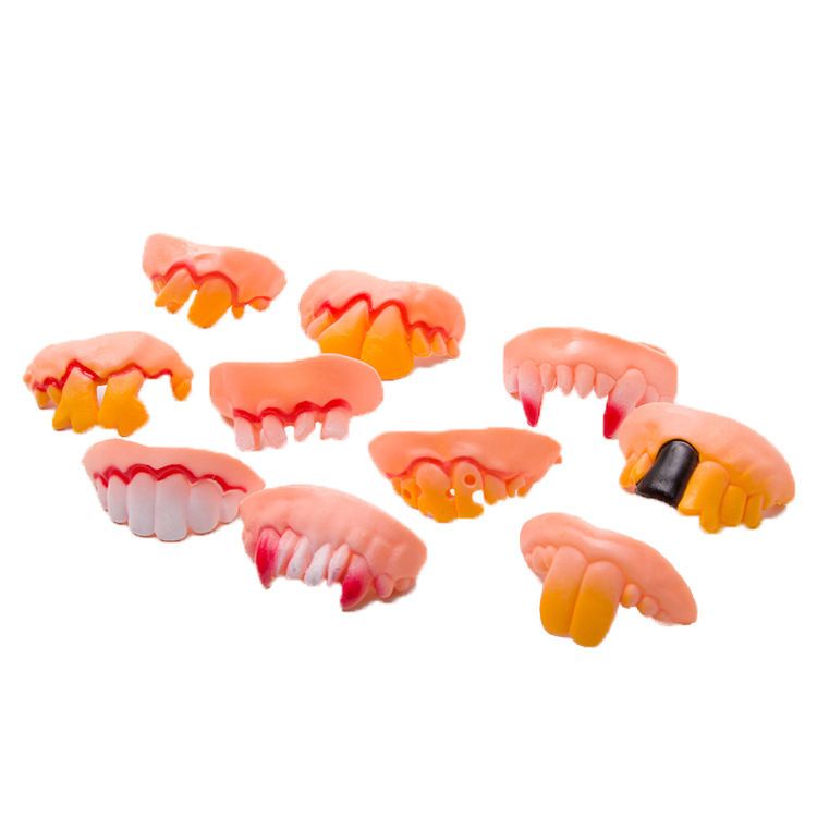 Set of 10 fake vampire fangs for Halloween costumes, featuring playful vampire denture teeth for kids' costume parties.