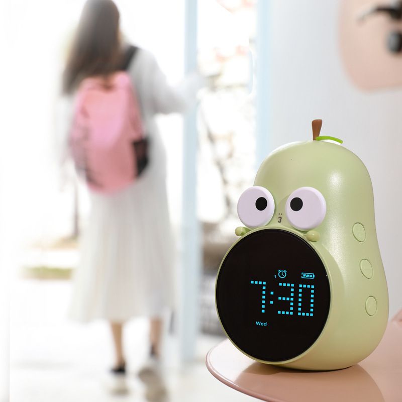 Cute pear-shaped kids' alarm clock by Everything Baby with triple alarms and five ringtones, designed for children's bedrooms.