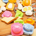 Eight-piece cartoon-shaped boil egg and sushi rice molds in fish, car, and heart shapes for kids' pretend play and cake decorating.