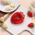 Stainless steel mini strawberry slicer from Everything Baby, ideal for cakes, fruit, and kitchen decorations.
