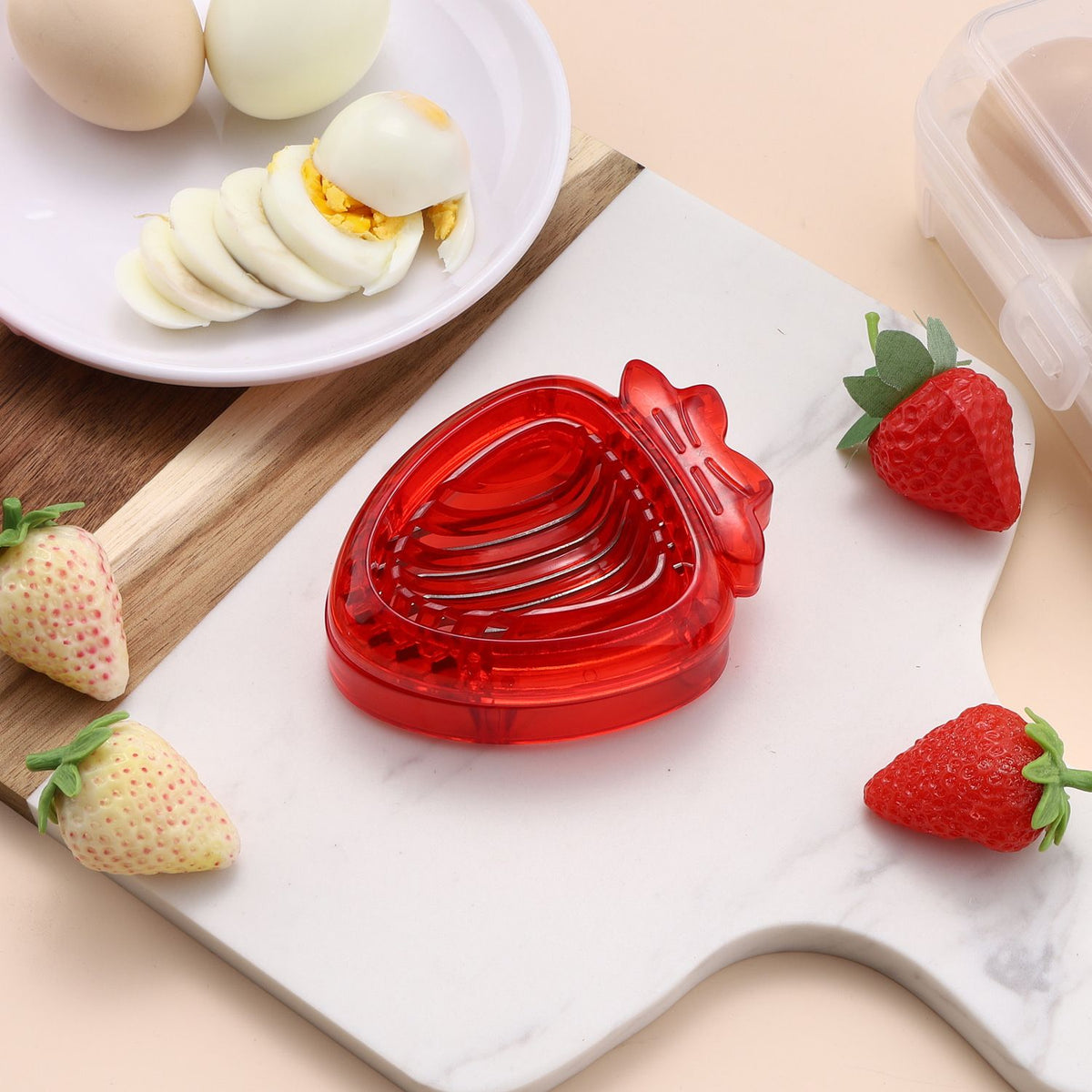 Stainless steel mini strawberry slicer from Everything Baby, ideal for cakes, fruit, and kitchen decorations.
