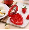Stainless steel mini strawberry slicer from Everything Baby, designed for cakes, pies, and fruit decorations in home kitchens.