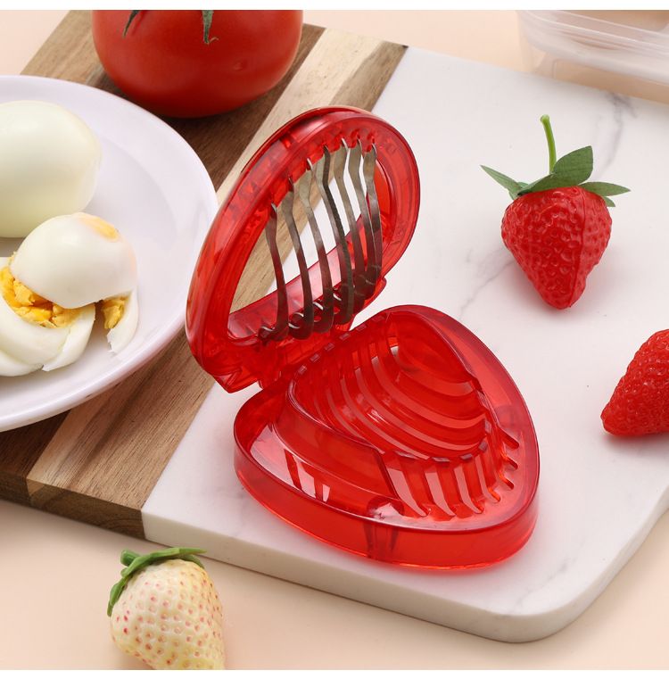 Stainless steel mini strawberry slicer from Everything Baby, designed for cakes, pies, and fruit decorations in home kitchens.