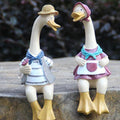 Resin garden statue of a baby and adult duck, outdoor yard decor, perfect for lawn or garden decoration.