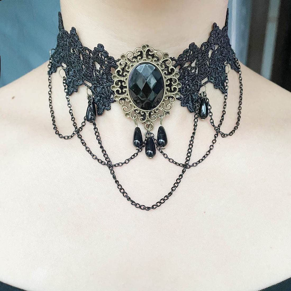 Black lace gothic choker necklace with tassel detail, stylish accessory for women, perfect for Halloween or gothic fashion.