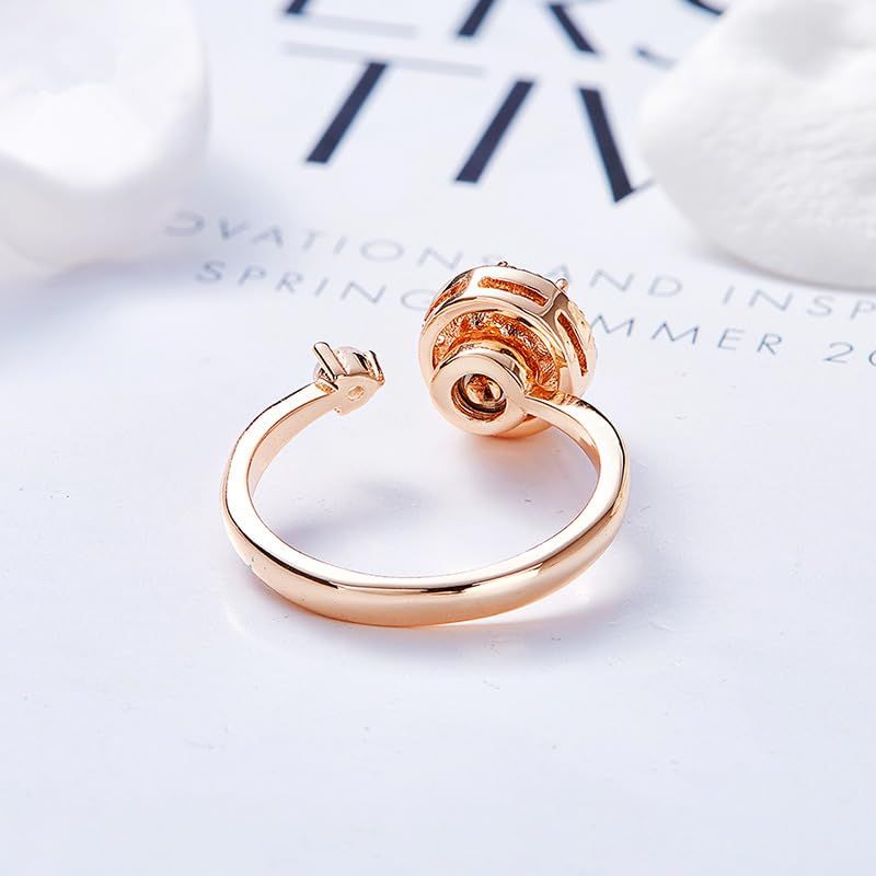 Two women's birthstone rings with crystal accents, open design, personalized fashion jewelry for matching and everyday wear.