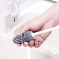 Silicone baby bottle brush with long handle from Everything Baby, designed for thorough cleaning without dead corners.