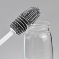 Silicone baby bottle brush with long handle from Everything Baby, designed for thorough cleaning without dead corners.