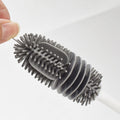 Silicone washing cup brush with long handle for baby bottles and cups, designed for thorough cleaning without dead corners.