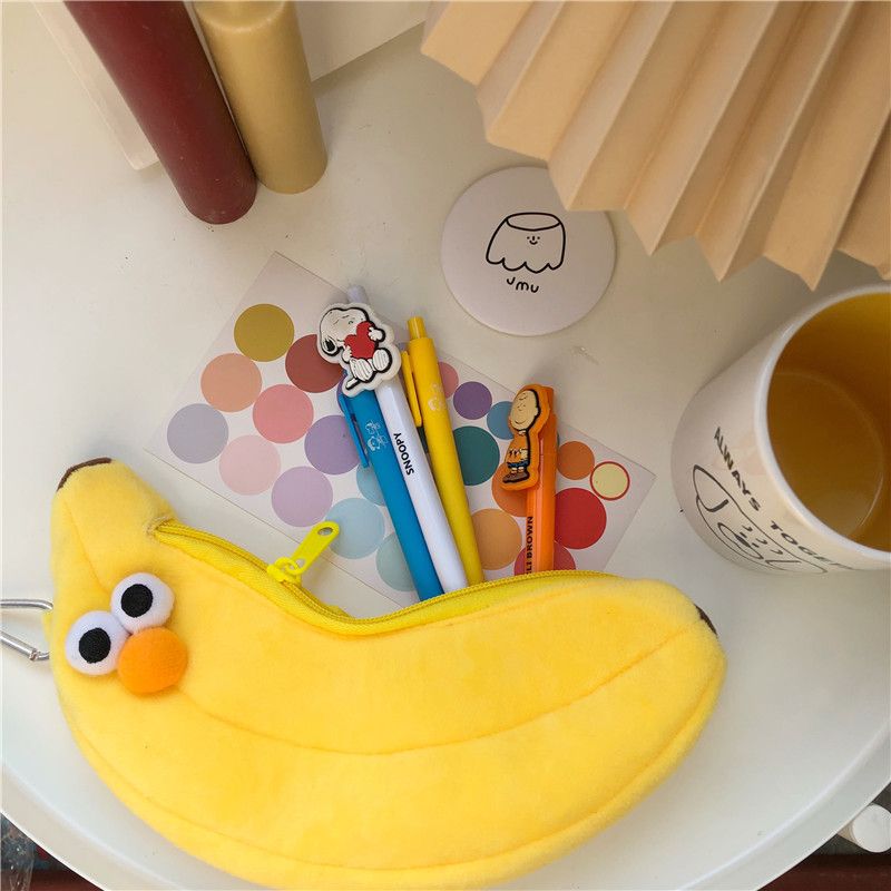 Cute novelty banana and chicken leg soft padded pencil case featuring funny face design, zipper closure, perfect for kids.