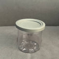 Colorful ice cream storage jar with dishwasher-safe lid in transparent, gray, pink, and water green, ideal for kids' lunch boxes.