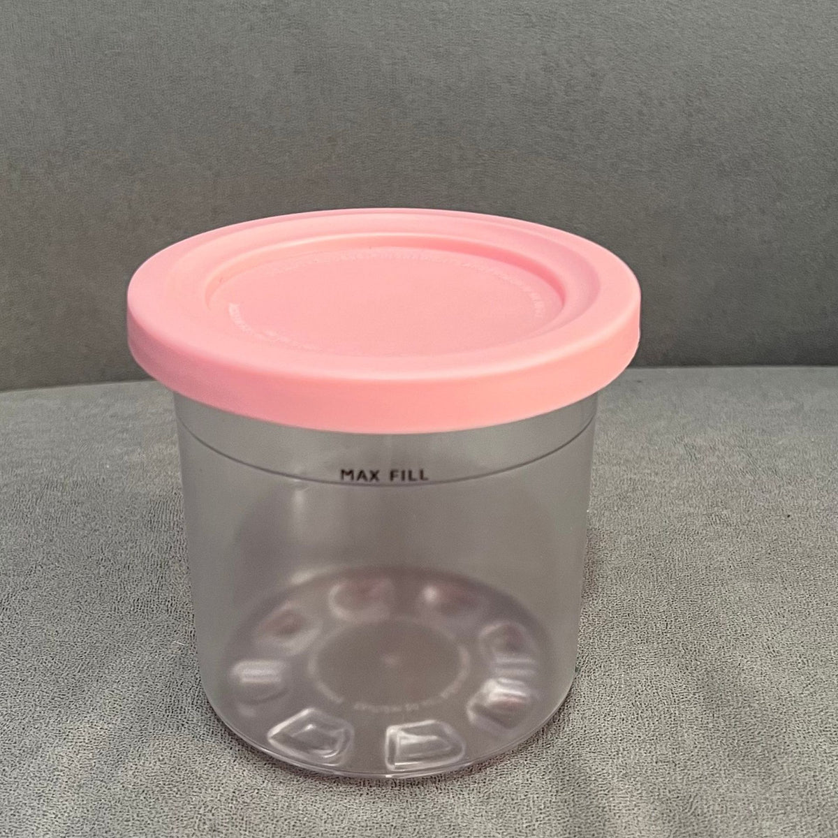Colorful ice cream storage jar with dishwasher-safe, transparent and colored lid in gray, stone gray, pink, and water green for kids.