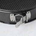 Stainless steel spring baking tray with detachable base and non-stick surface, designed for pretend play with baby and kids' toy kitchen accessories.