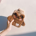 Brown cartoon hot water bottle with plush cover, portable hand warmer for kids, featuring cute design and water injection function.
