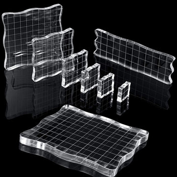 Seven clear acrylic stamp blocks with grid and grip, ideal for kids' scrapbooking and decorative stamping projects.