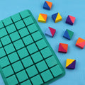 Square silicone chocolate mold by Everything Baby for candy, ice cubes, and baking, featuring a grid design for pretend play.