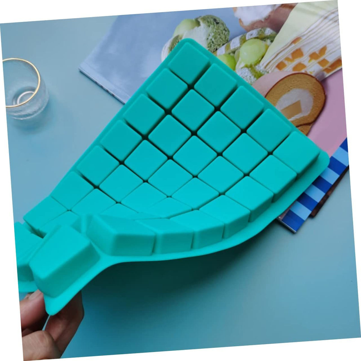 Silicone square chocolate mold by Everything Baby for making candy, ice cubes, and pretend play baking with Nama chocolate design.