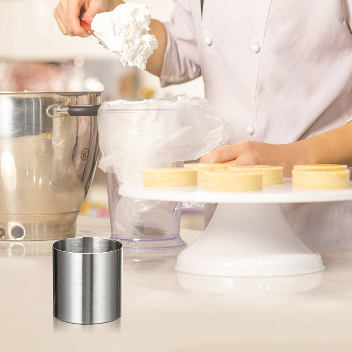 Stainless steel round cake ring mold used for mousse, pastry, and dessert shaping, ideal for baking and decorating.