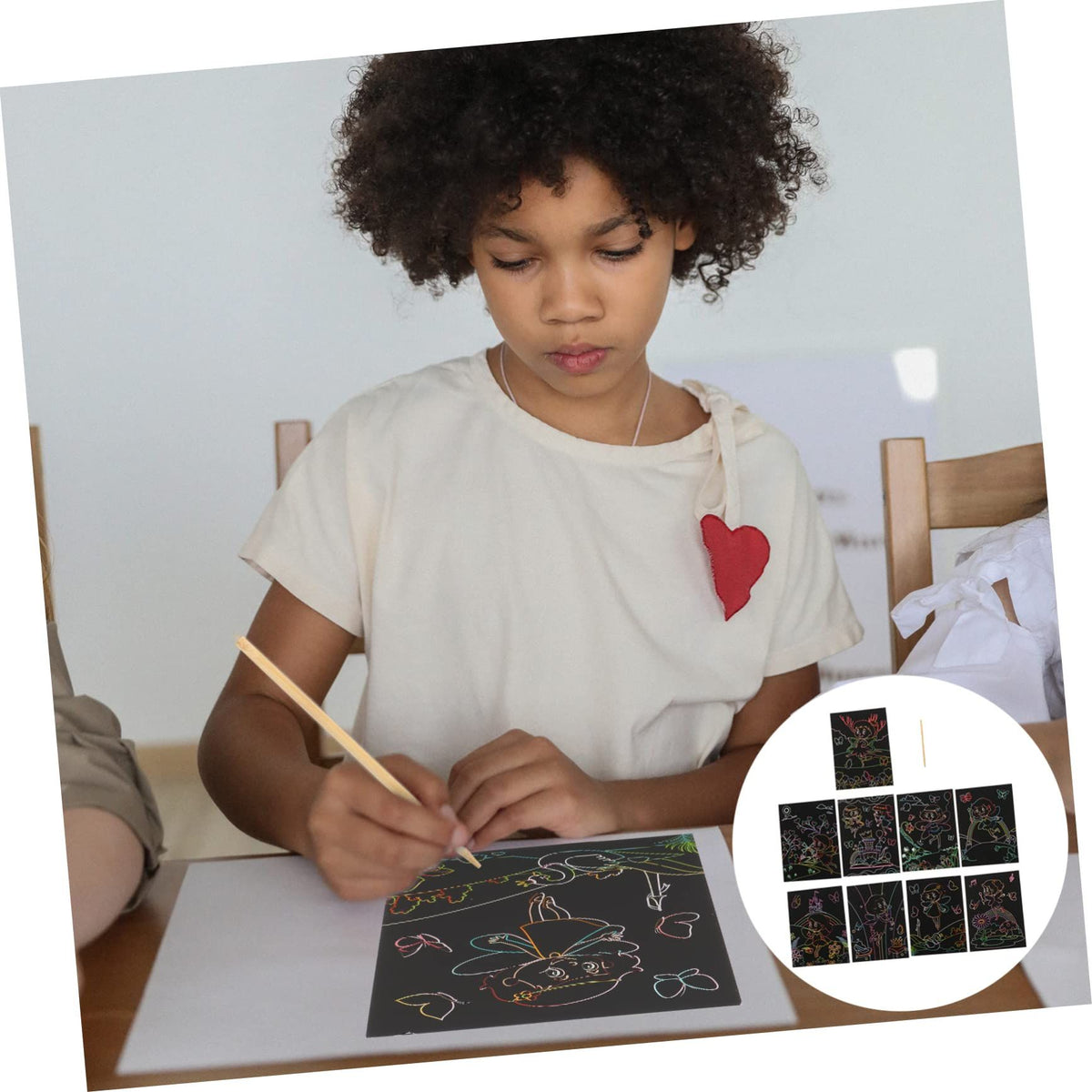 Set of 10 rainbow scratch paper art pads for kids, featuring black scratch boards for drawing and craft projects.