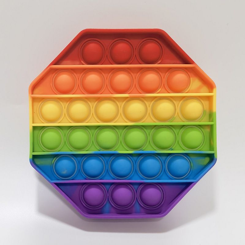 Colorful sensory silicone stress relief toys for kids and adults, designed for autism and special needs, in a toy box.