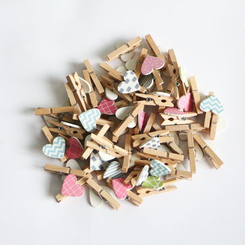 Set of 50 mini wooden heart-shaped clips for kids' crafts, photo holders, and paper peg pins by Everything Baby.