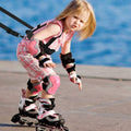 Black kids ski safety straps and harness with removable leash for skiing and skating training, designed for child safety.