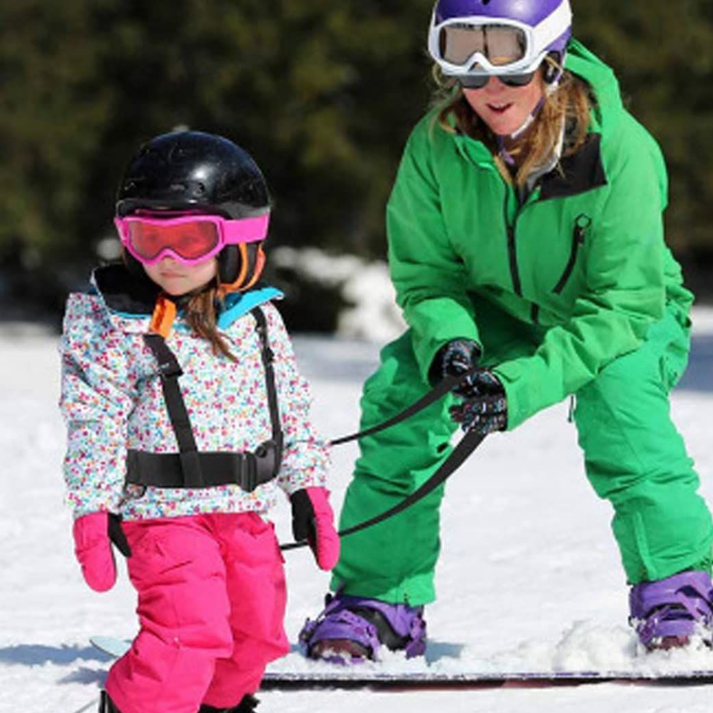 Black kids ski safety harness with removable leash, designed for skiing and skating training, from Everything Baby.
