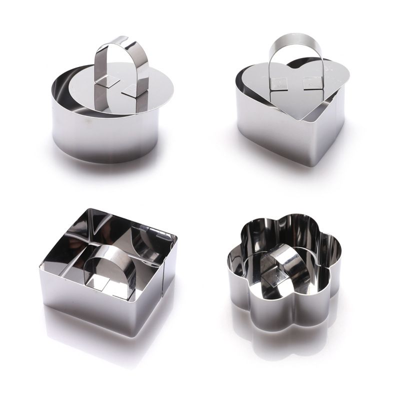 Set of four stainless steel 3D cake molds with pushers and lifters, ideal for baking cupcakes, mousse, and creative cake decorating.