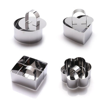 Set of four stainless steel 3D cake molds with pushers and lifters, ideal for baking cupcakes, mousse, and creative cake decorating.