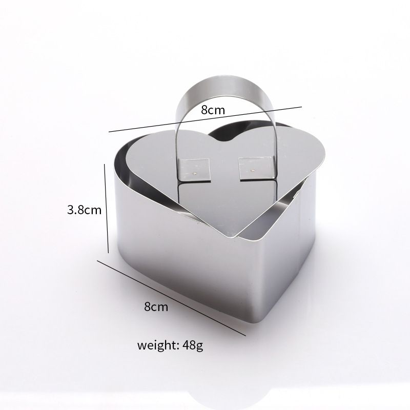 Set of four stainless steel 3D cake molds with pushers and lifters for baking, ideal for creating detailed cupcakes and mousse.