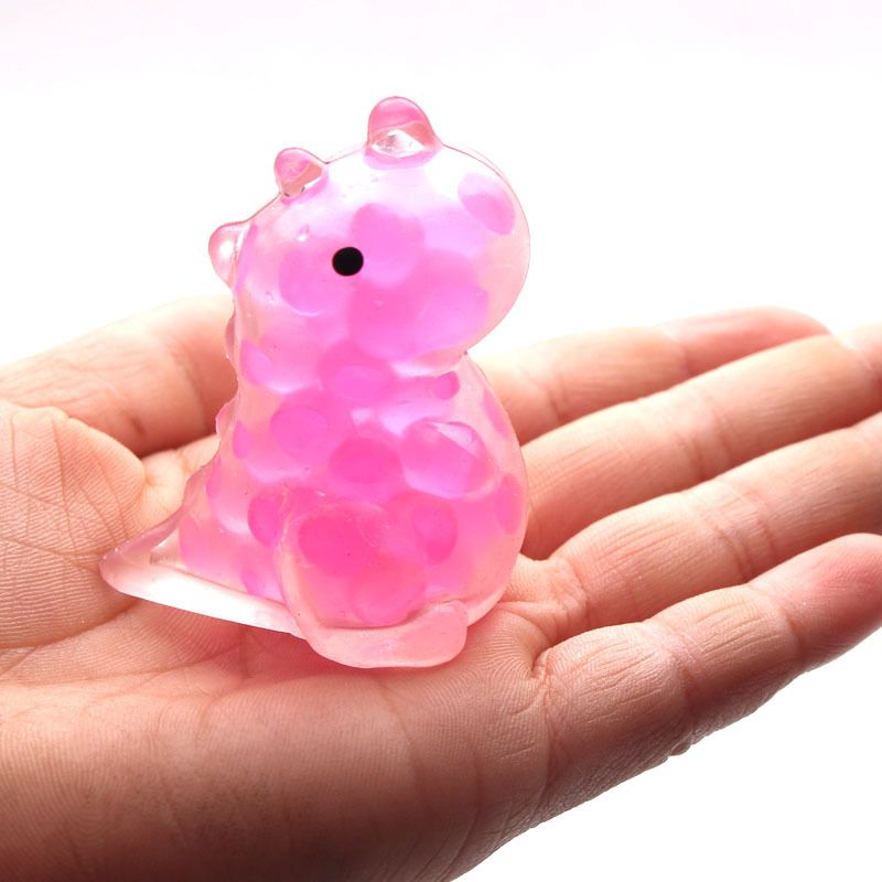 Set of 12 colorful dinosaur pinch toys for kids, made of smooth-edged, textured silicone to help relieve stress and promote focus.