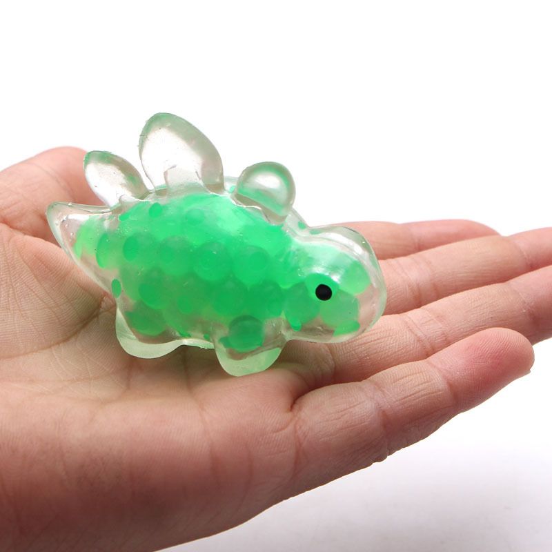 Colorful dinosaur-shaped pinch toy with smooth edges and clear texture, designed for stress relief and sensory play for kids.