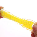 Colorful dinosaur-shaped pinch toy with smooth edges and clear texture, designed to relieve stress for kids and babies.