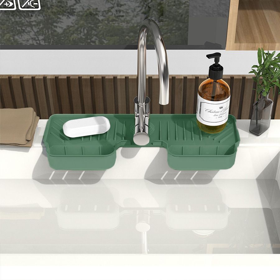 Two silicone faucet splash guard mats with dish sponge holders, designed to catch water and keep sinks dry.