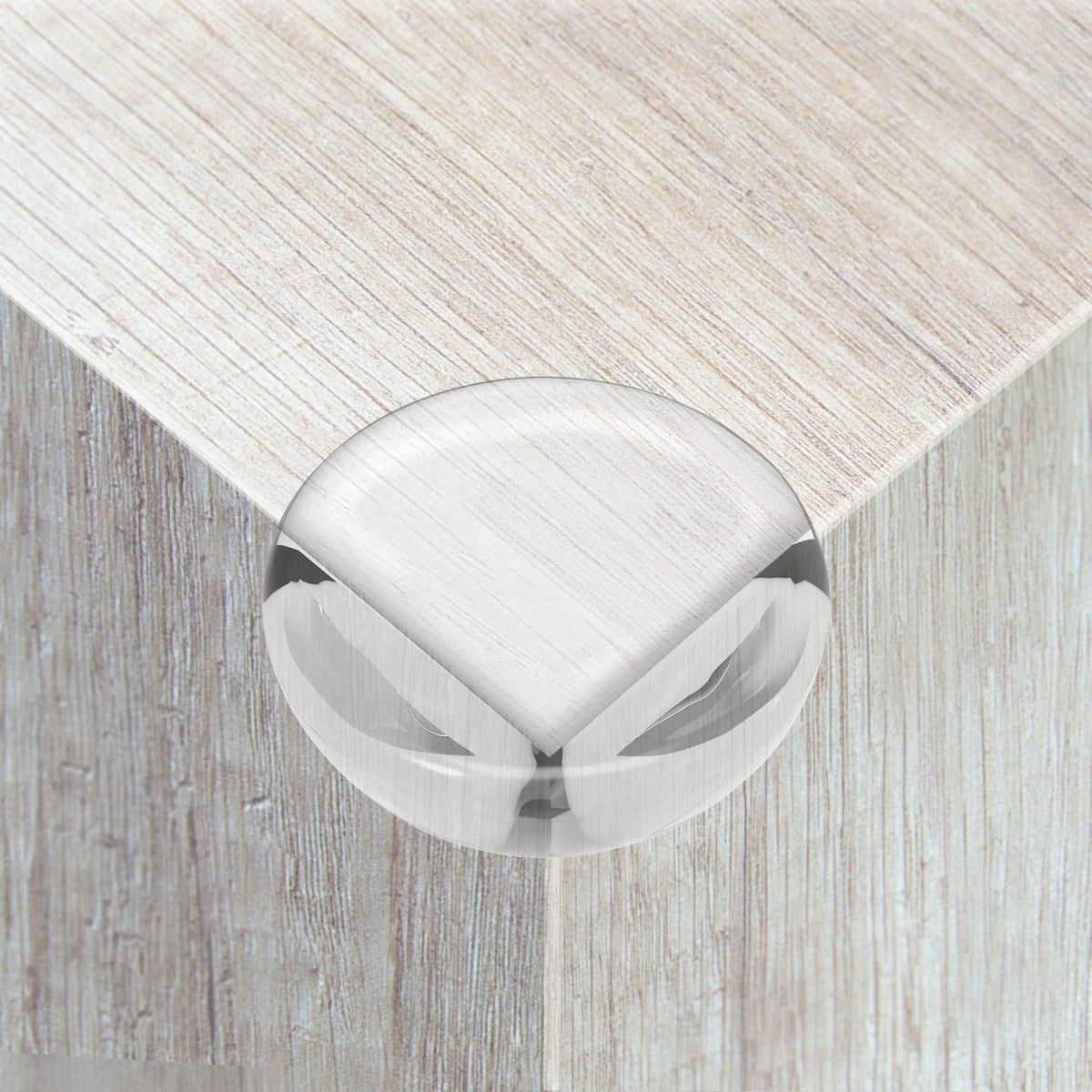 Set of 12 clear ball-shaped corner guards for baby furniture, edge protectors to prevent injuries on tables and sharp corners.