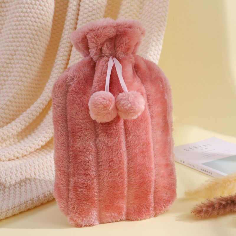 Large 2L hot water bottle with faux fluffy cover from Everything Baby, leakproof rubber for back, neck, and leg relief.