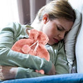 Large 2L rubber hot water bottle with faux fluffy cover, ideal for soothing back, neck, and leg pain, leakproof design by Everything Baby.