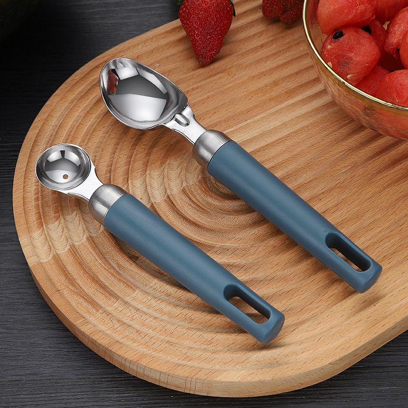 Two gourmet ice cream scoops with ergonomic handles, dishwasher-safe, ideal for serving ice cream and desserts.
