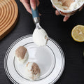 Two gourmet ice cream scoops with ergonomic handles, dishwasher safe, ideal for serving ice cream and desserts.