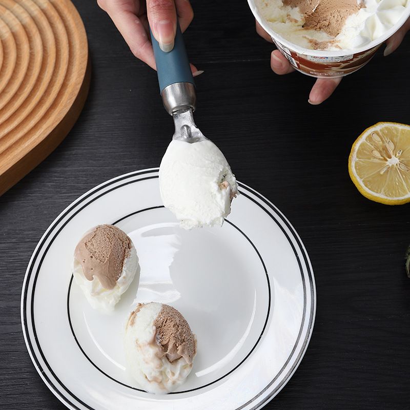 Two gourmet ice cream scoops with ergonomic handles, dishwasher safe, ideal for serving ice cream and desserts.