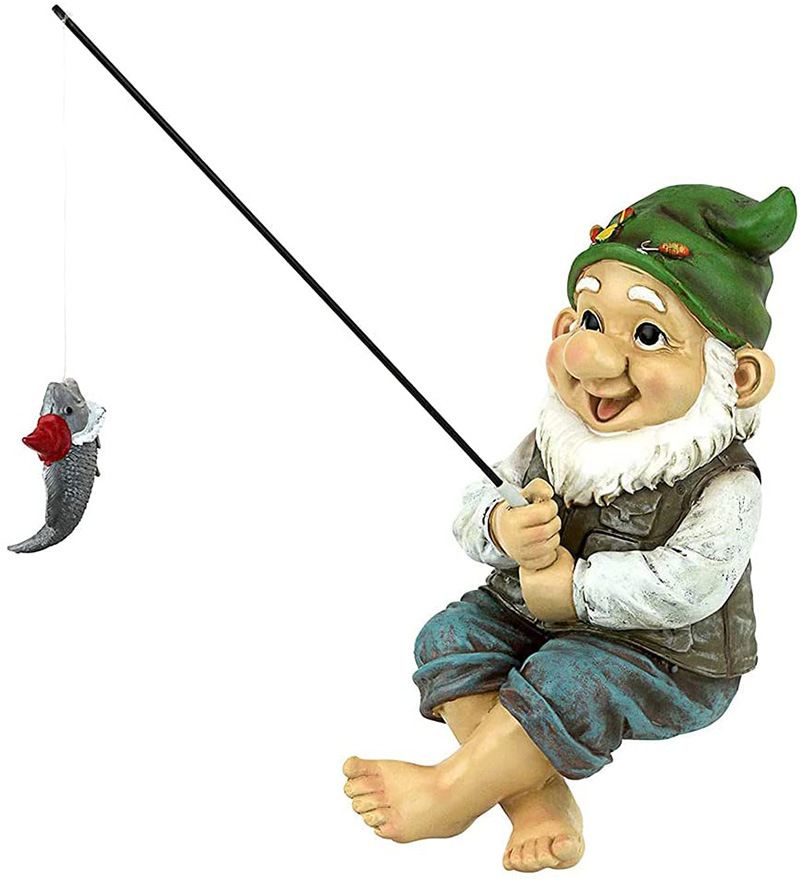 Outdoor garden fishing gnome statue sitting near a pond, decorative craft for garden decor by Everything Baby