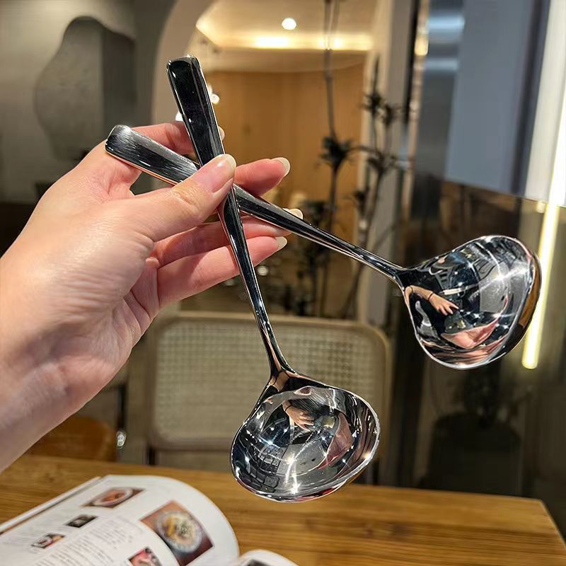 Two stainless steel gravy and soup ladles for kids' pretend play, small kitchen utensils for serving soup, sauce, and gravy.
