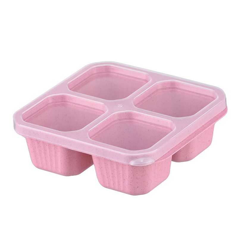 Pink reusable bento lunch box with lid and four compartments, stackable food container for kids, compact and travel-friendly from Everything Baby.