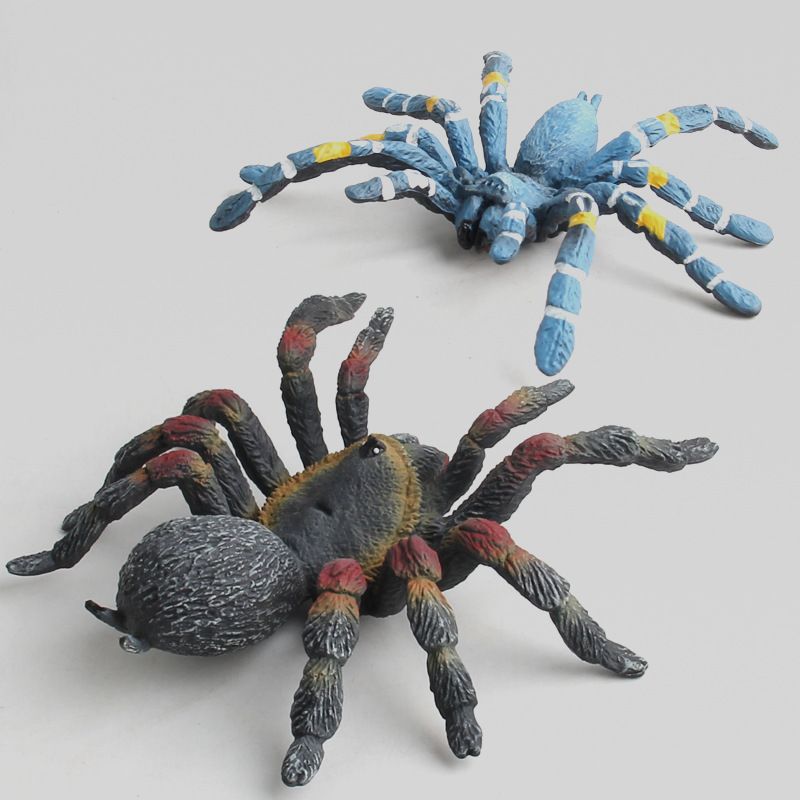 Set of four realistic plastic spider figurines for science education and collection, suitable for outdoor toy play.