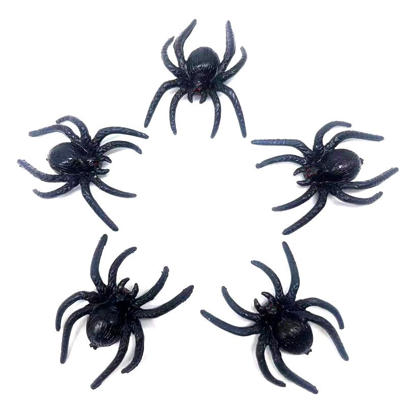 Set of 10 realistic black plastic fake spiders for Halloween decor and pretend play, perfect for spooky toy props.